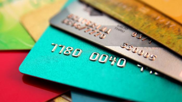 stack of multicolored credit cards, close up view with selective focus