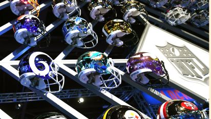 Getty Images - Team helmets are on display at the Super Bowl Experience at the World Congress Center in Atlanta, Georgia February 1, 2019. - The New England Patriots will meet the Los Angeles Ram at Super Bowl LIII on February 3. (Photo by TIMOTHY A. CLARY / AFP)        (Photo credit should read TIMOTHY A. CLARY/AFP via Getty Images)