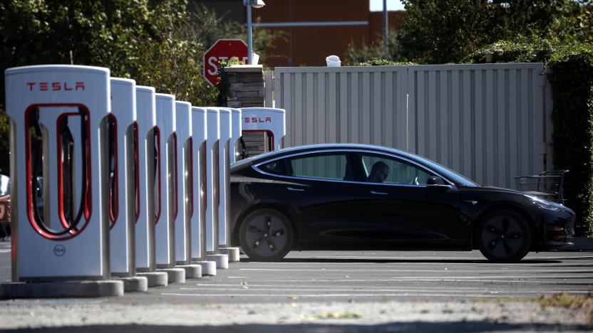 PETALUMA, CALIFORNIA - SEPTEMBER 23: A Tesla car sits parked at a Tesla Supercharger on September 23, 2020 in Petaluma, California. California Gov. Gavin Newsom signed an executive order directing the California Air Resources Board to establish regulations that would require all new cars and passenger trucks sold in the state to be zero-emission vehicles by 2035. Sales of internal combustion engines would be banned in the state after 2035. (Photo by Justin Sullivan/Getty Images)