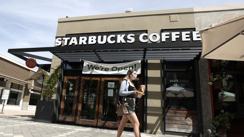 CORTE MADERA, CALIFORNIA - JUNE 10: A customer walks by a Starbucks Coffee store on June 10, 2020 in Corte Madera, California. Starbucks announced plans to close 400 of its company owned cafes over the next 18 months as the coffee shop chain estimates losing over $3 billion due to the coronavirus COVID-19 pandemic. (Photo by Justin Sullivan/Getty Images)