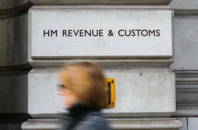 LONDON, UNITED KINGDOM - 2020/02/05: A woman walks past HM Revenue & Customs building on Whitehall in London. (Photo by Dinendra Haria/SOPA Images/LightRocket via Getty Images)