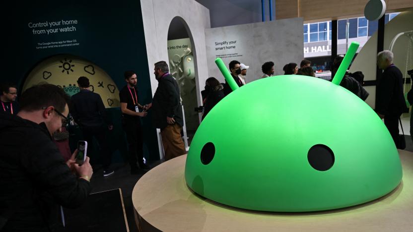 Attendees take pictures of a large Android logo head at Alphabets Google Android plaza booth during the Consumer Electronics Show (CES) in Las Vegas, Nevada on January 5, 2023. (Photo by Patrick T. Fallon / AFP) (Photo by PATRICK T. FALLON/AFP via Getty Images)