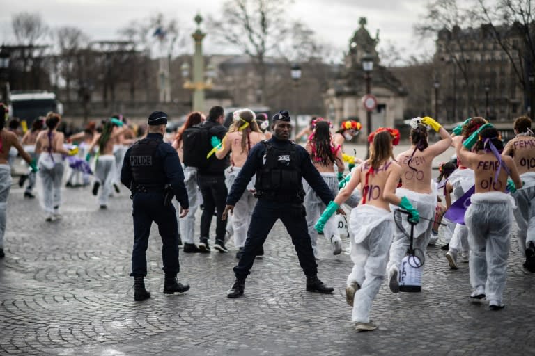 Topless Femen activists demonstrated at Place de la Concorde in Paris denouncing 'the patriarchal pandemic' (AFP Photo/Martin BUREAU)