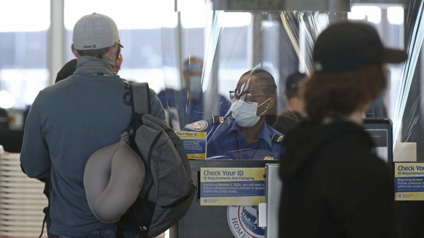 A Transportation Security Administration agent works at the security check area inside Terminal 3 at O&apos;Hare International Airport on Nov. 12, 2020, in Chicago. (John J. Kim/Chicago Tribune/Tribune News Service via Getty Images)