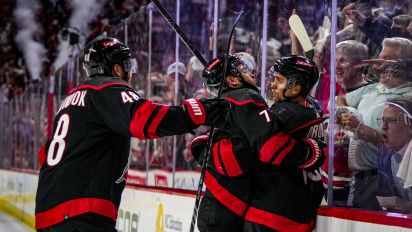 Getty Images - RALEIGH, NORTH CAROLINA - APRIL 30:  Jack Drury #18 of the Carolina Hurricanes celebrates with teammates after a goal during the third period against the New York Islanders in Game Five of the First Round of the 2024 Stanley Cup Playoffs at PNC Arena on April 30, 2024 in Raleigh, North Carolina. (Photo by Josh Lavallee/NHLI via Getty Images)