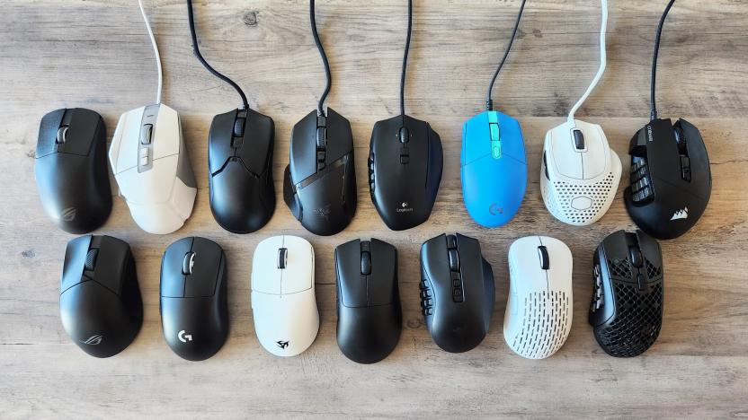 A collection of the gaming mice we tested for our buying guide, neatly laid out on a brown wooden table.