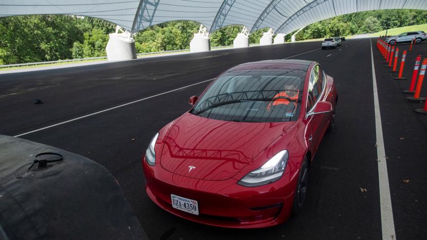 Philip Floyd, senior engineering technician for the Insurance Institute for Highway Safety (IIHS), demonstrates a front crash prevention test on a 2018 Tesla Model 3 at the IIHS-HLDI Vehicle Research Center in Ruckersville, Virginia, U.S., July 22, 2019. Picture taken July 22, 2019. REUTERS/Amanda Voisard