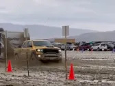 Video of a Ram truck flying through Burning Man's mud trap while hauling an RV is the best ad a car company could ask for