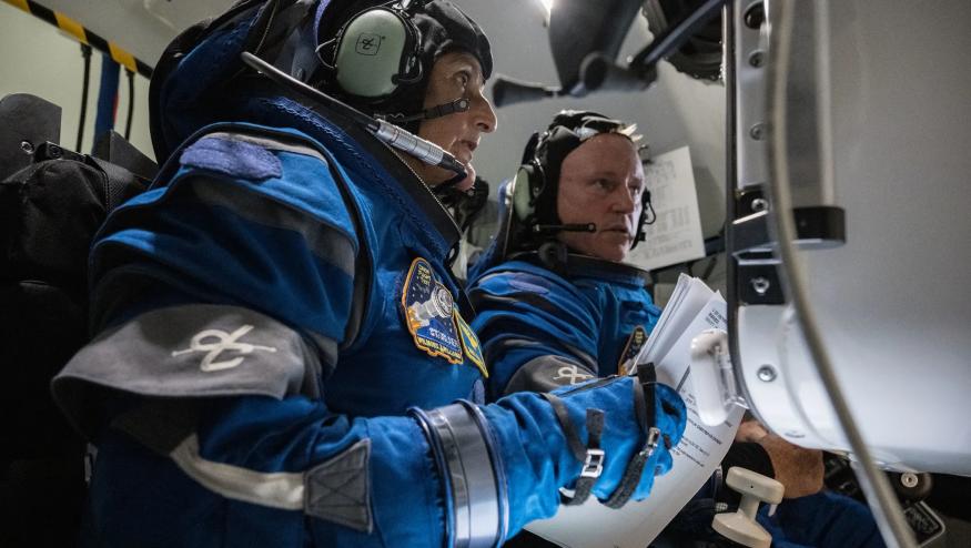 NASA astronauts Suni Williams and Butch Willmore inside the Boeing Starliner simulator