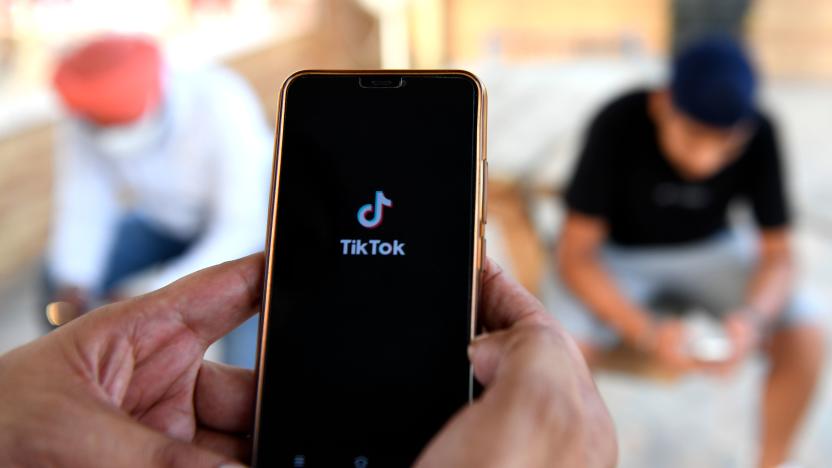 Indian mobile users browses through the Chinese owned video-sharing 'Tik Tok' app on a smartphones in Amritsar on June 30, 2020. - TikTok on June 30 denied sharing information on Indian users with the Chinese government, after New Delhi banned the wildly popular app citing national security and privacy concerns.
"TikTok continues to comply with all data privacy and security requirements under Indian law and have not shared any information of our users in India with any foreign government, including the Chinese Government," said the company, which is owned by China's ByteDance. (Photo by NARINDER NANU / AFP) (Photo by NARINDER NANU/AFP via Getty Images)