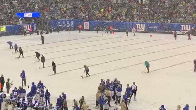 The MetLife Stadium field crew had a busy day shoveling snow at the Packers- Giants game