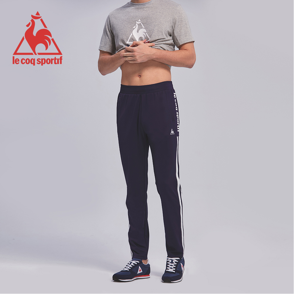 le coq sportif 法國公雞牌彈性吸排側邊直條紋印花長褲 男-丈青