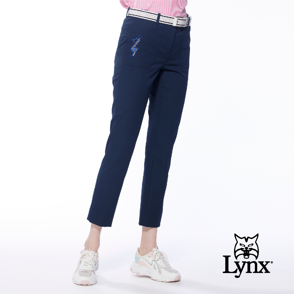 【Lynx Golf】女款彈性舒適貼袋造型精美山貓繡花窄管九分褲-深藍色