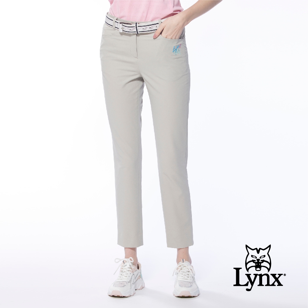 【Lynx Golf】女款吸濕排汗彈性布料後片透氣織帶設計窄管九分褲-卡其色