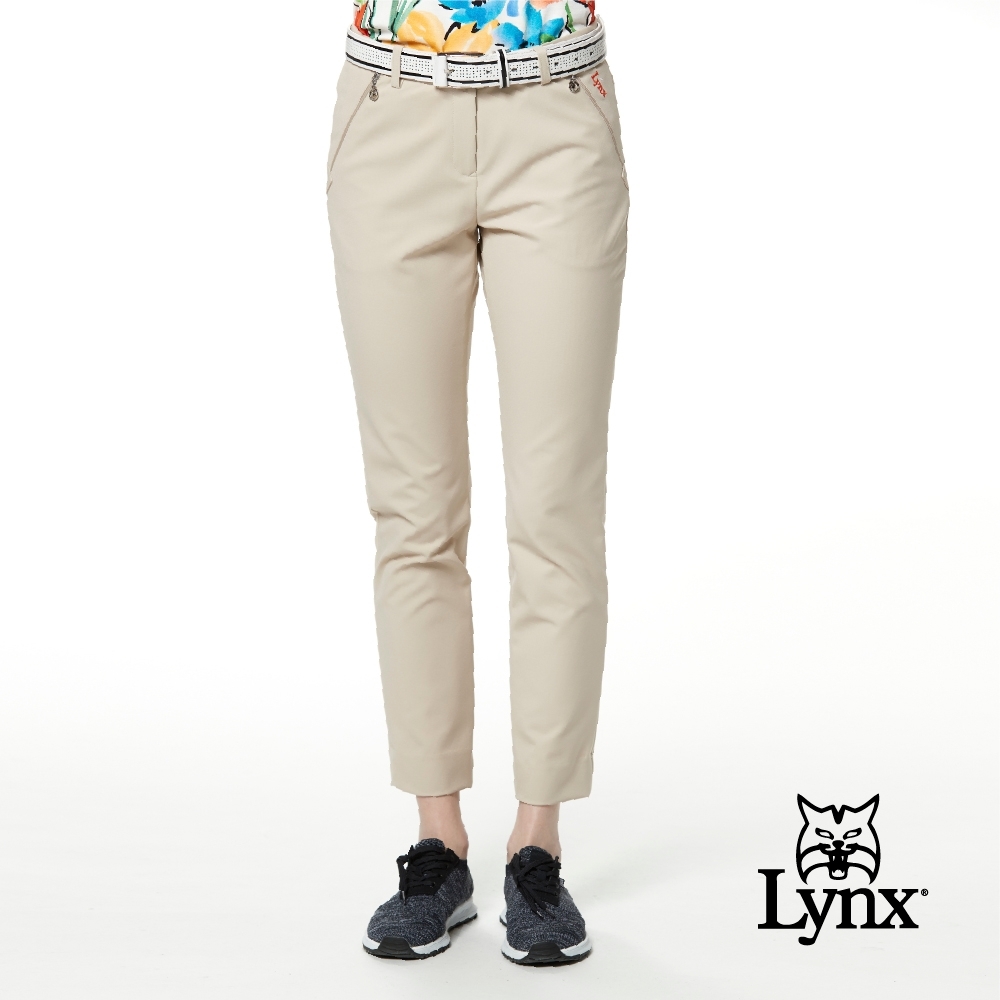 【Lynx Golf】女款彈性舒適拉鍊口袋素面窄管九分褲-卡其色