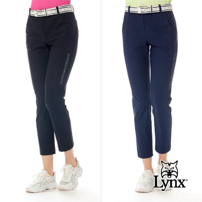 【Lynx Golf】女款日本進口布料彈性脇邊LOGO織帶剪裁設計窄管九分褲(二色)