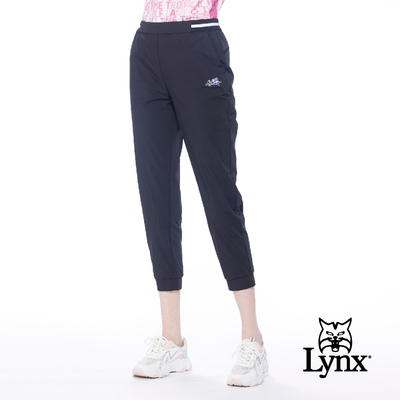 【Lynx Golf】女款彈性舒適羅紋腰頭網狀織帶搭配錐形九分褲-黑色