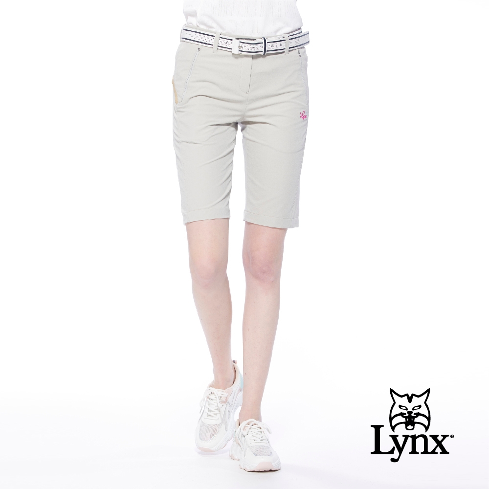 【Lynx Golf】女款吸濕排汗彈性舒適拉鍊口袋織帶設計直筒五分褲-卡其色