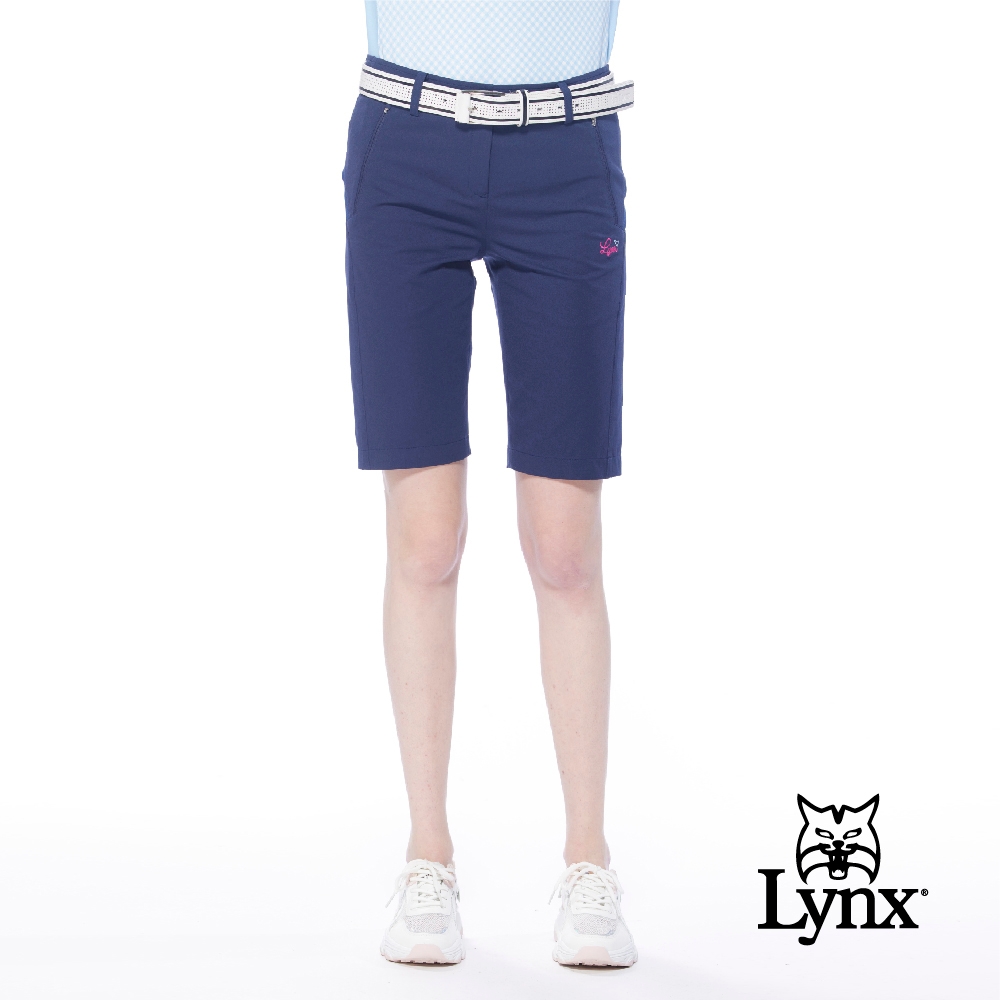 【Lynx Golf】女款吸濕排汗彈性舒適拉鍊口袋織帶設計直筒五分褲-深藍色