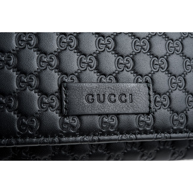 GUCCI經典Guccissima系列雙G壓紋LOGO皮革扣式長夾(黑色)