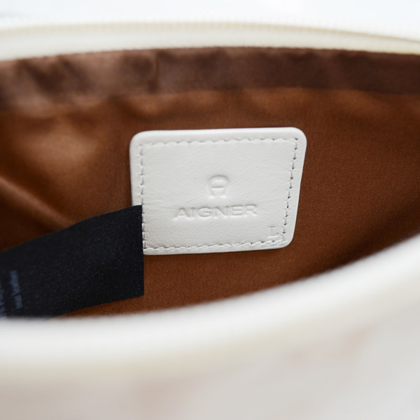 Aigner 愛格納 福袋組 TRCO系列尼龍旅行肩側背包+白色緹花化妝包+小牛皮手環