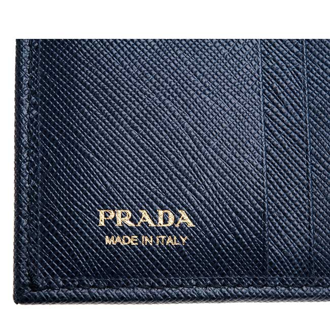 PRADA 經典浮雕金字LOGO十字紋防刮牛皮扣式三折短夾 (深藍)