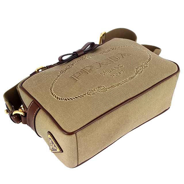 PRADA 刺繡帆布咖啡色蝴蝶結皮飾邊斜肩包